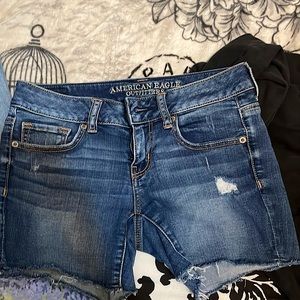 American Eagle midi short. Slightly distressed with raw hem. Size 4